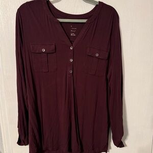 Maroon soft, flowy top with button up sleeves
